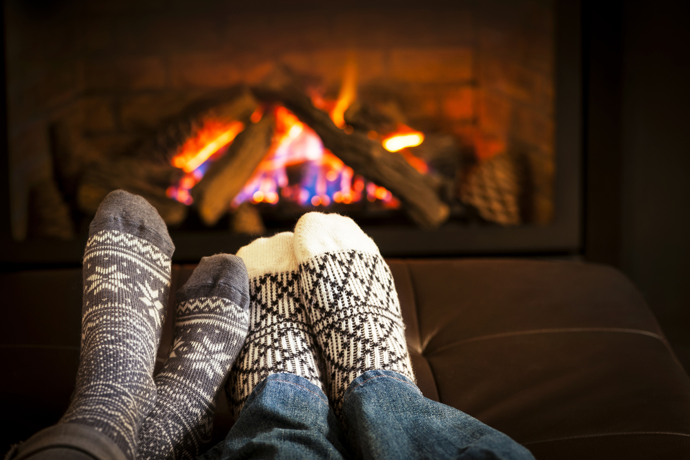 Feet warming by the fire during the winter