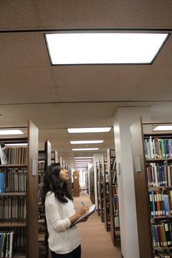 Lynae Salgado, student intern and manager for the Cal Poly Pomona team, takes notes during a lighting audit of the campus’ main library
